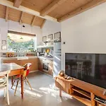 Tiny House On Water Surrounded By Greenery