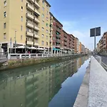 Green Duckling On The Canal